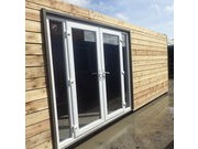 PATIO DOORS AND BI-FOLDING DOORS IN SHIPPING CONTAINERS
